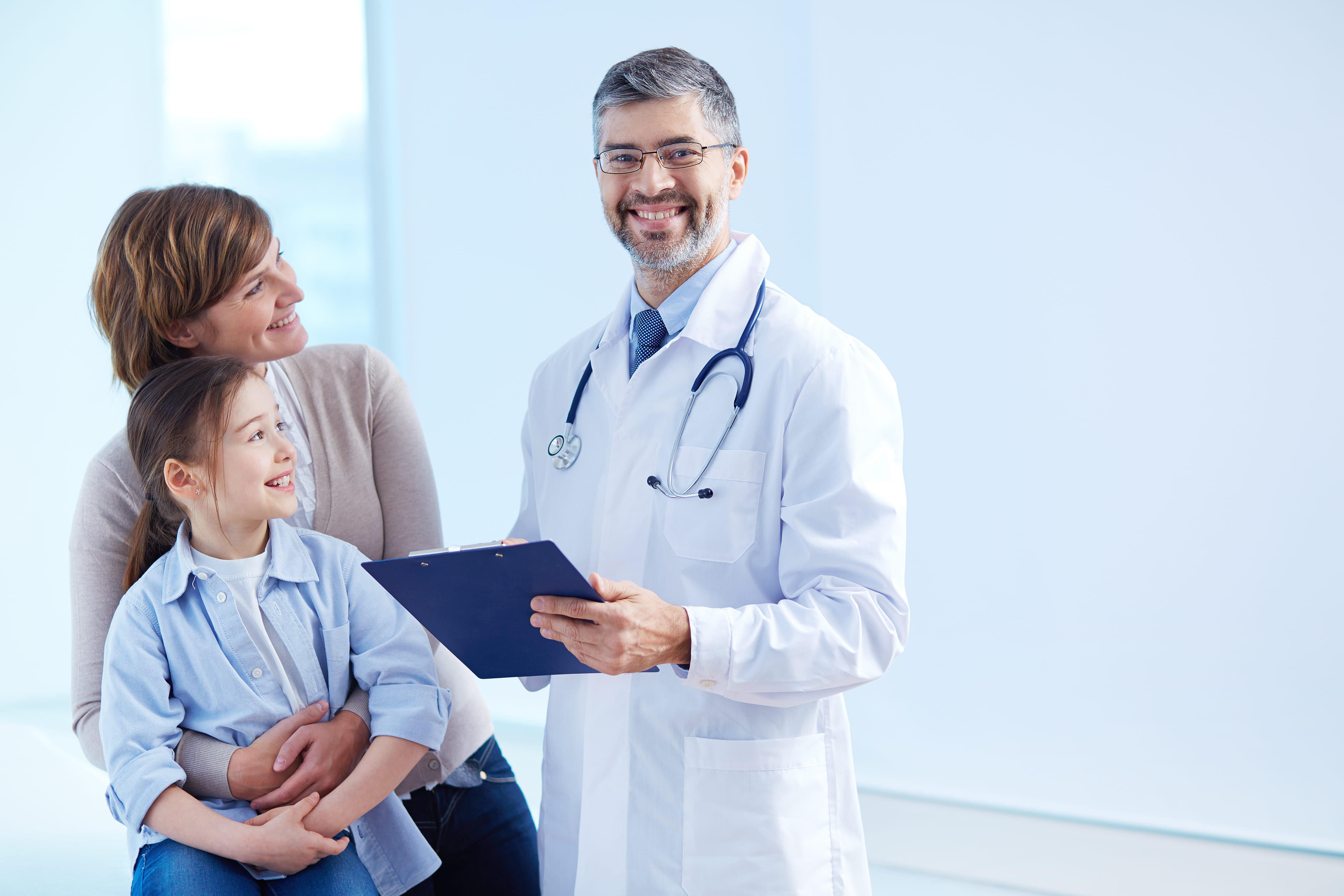 Doctor discussing results with patient and child
